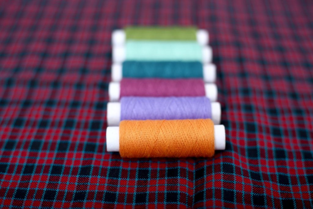 How to choose a clothing manufacturer thread, embroidery, sewing, garment, fabric, manufacturing, reel, tailor, fashion, accessories, cloth, craft, design, industry, material, needlework, colorful, colors, crafts, multicolored, spool, yarn, clothing, tailoring, sewing thread
